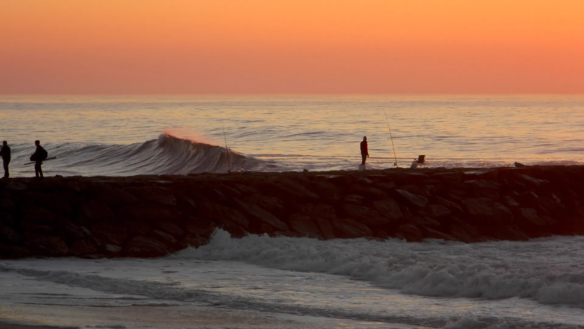 Sunset light reflecting on Atlantic waves near Porto
