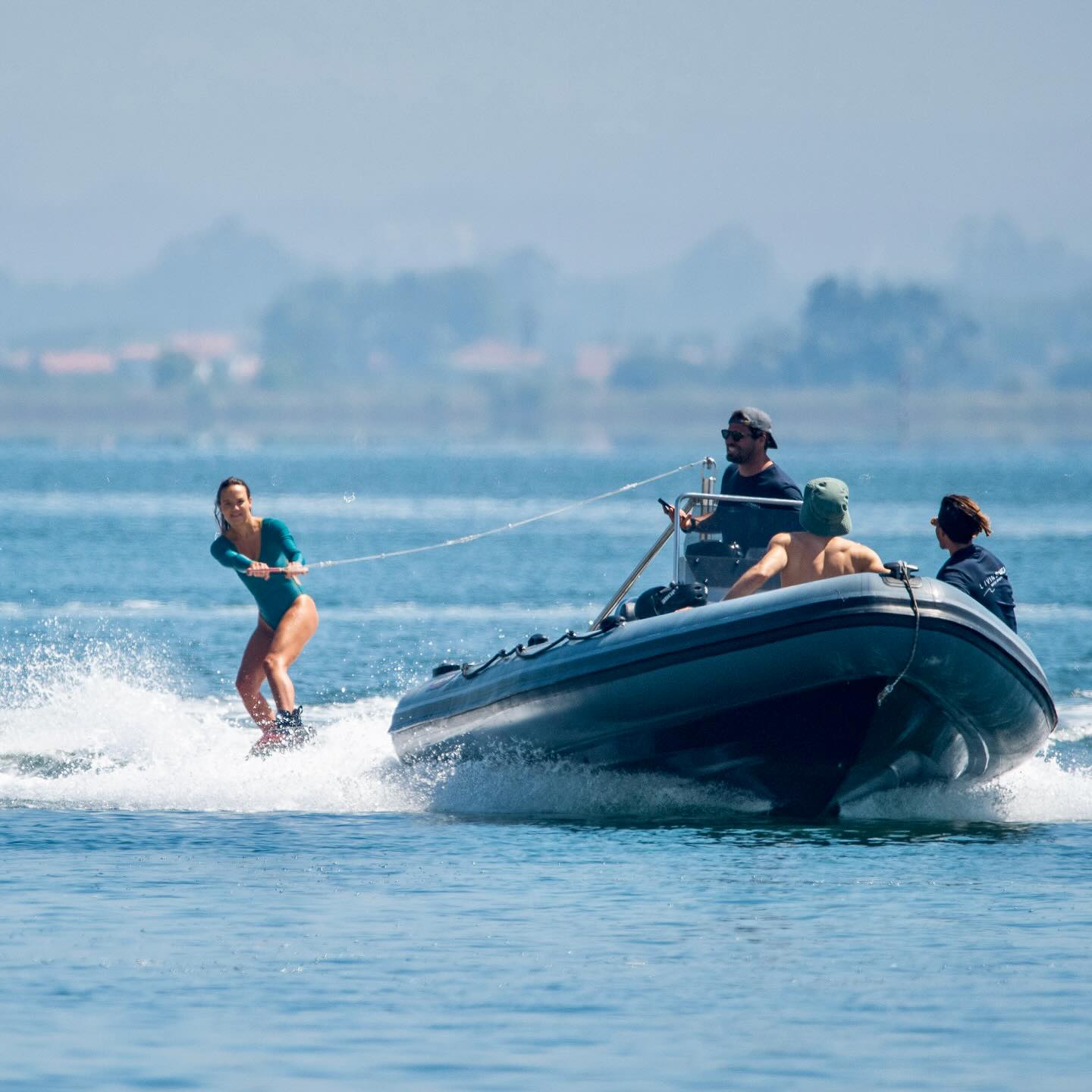 Private wakesurf boat on the water ready for a guided session